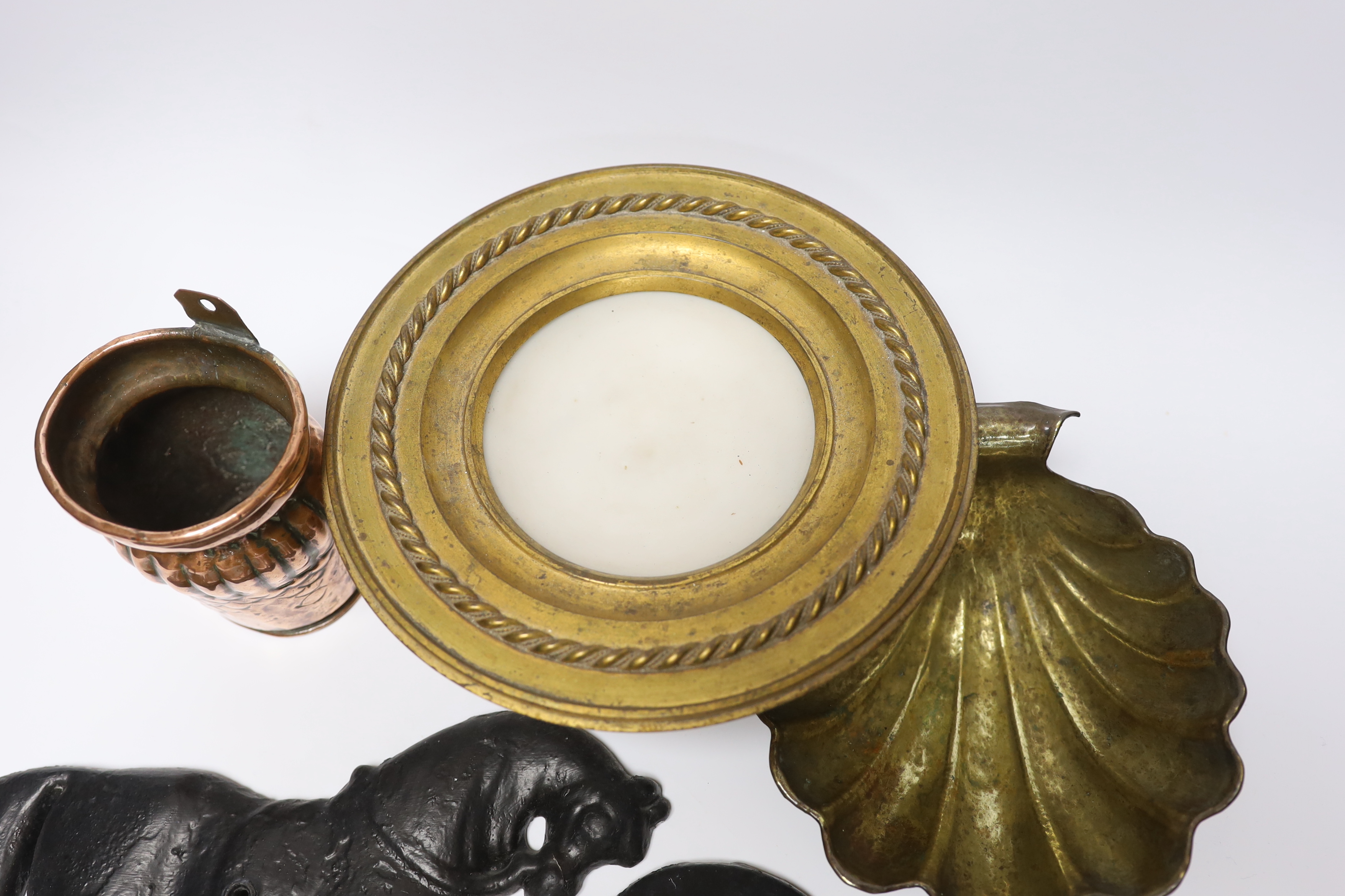 A group of metalware to include a pair of lead ‘horse’ wall mounts, a copper wall pocket, a , brass ‘scallop shell’ dish, a telescopic three pronged fork and an alabaster pedestal dish